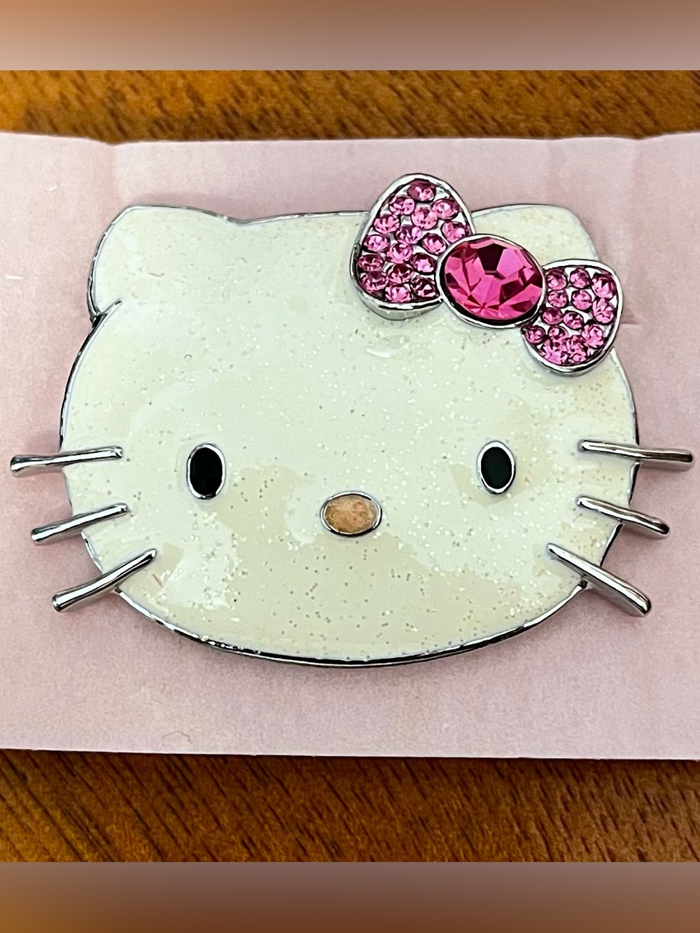 Hello Kitty white sparkling enamel and pink stone bow brooch.